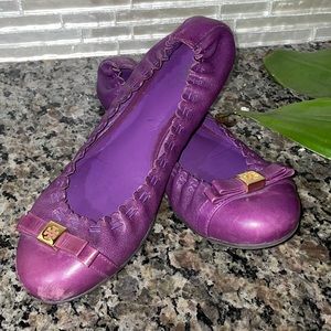 Tory Burch ROMY.  Ballet flat with bow and gold logo.  Purple.  6.5